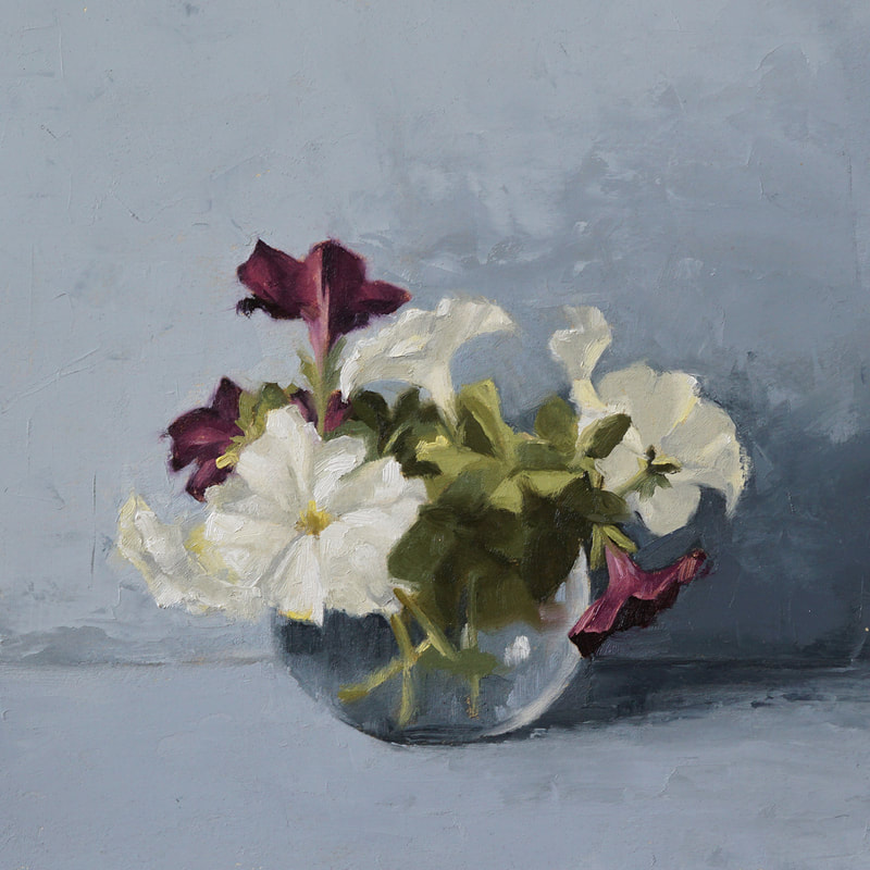 Still life oil painting of white and red-violet petunias in a clear, rounded vase with a blue-gray background. Nicole Lamothe artwork