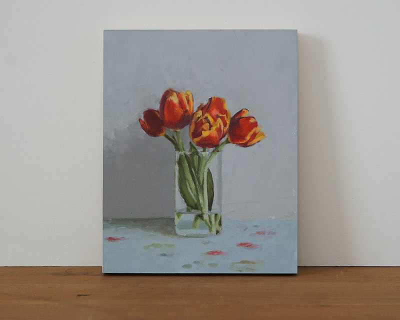  Still life oil painting of red and yellow tulips in a glass with blue and gray background. Nicole Lamothe artwork